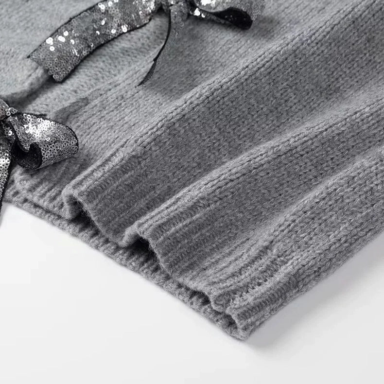 Strickjacke mit Pailletten-Schleifen