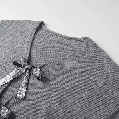 Elegancia a la luz de la luna – Cárdigan con lazos de lentejuelas