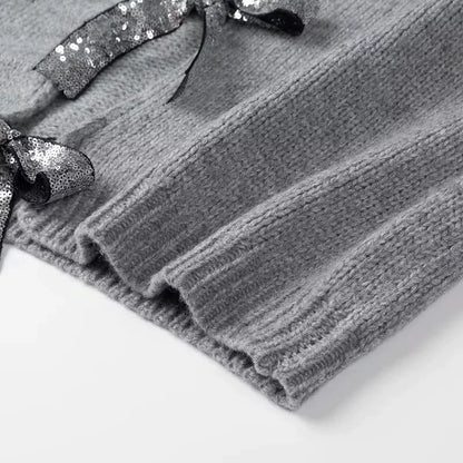 Elegancia a la luz de la luna – Cárdigan con lazos de lentejuelas