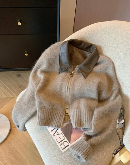 Cárdigan elegante con detalles de piel sintética.